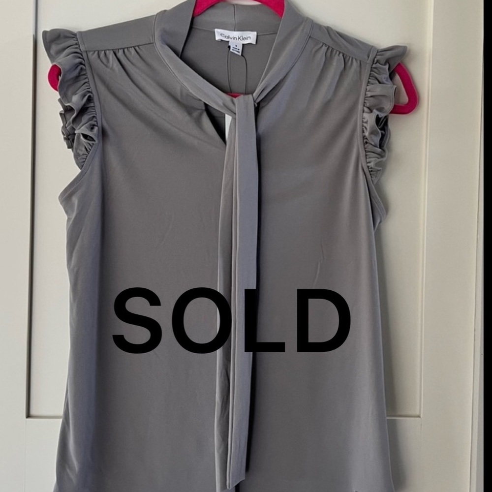 SOLD.  🌿HOST PICK 🌿Calvin Klein Blouse with ruffle cap sleeves. NWT Size S